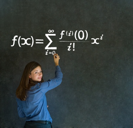 Learn Math or Maths confident beautiful woman teacher chalk blackboard backgroundの写真素材