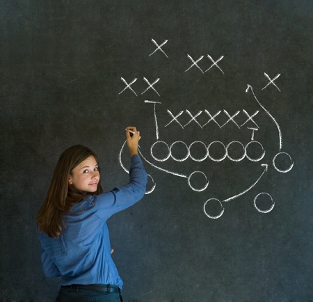 Business woman, student, teacher or coach American football strategy on blackboard backgroundの写真素材