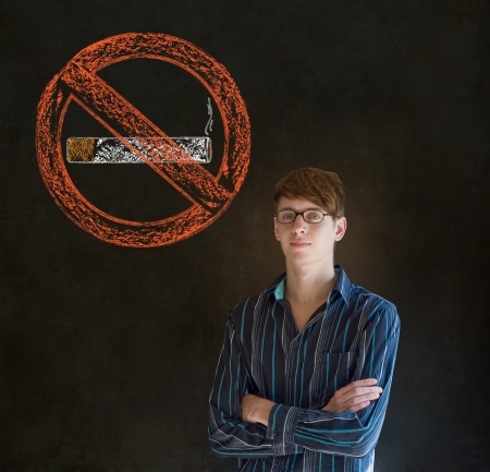 No smoking tobacco addict business man, student or teacher on blackboard backgroundの写真素材