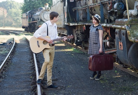 Retro hip hipster romantic love couple serenade  vintage train settingの写真素材