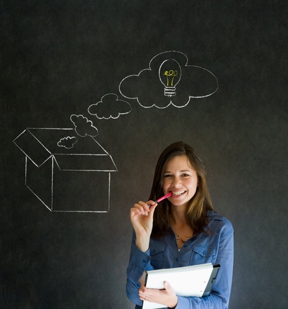 Businesswoman, student or teacher thinking out the box chalk concept blackboard backgroundの写真素材