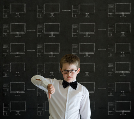 Thumbs down boy with chalk networks on blackboard backgroundの写真素材