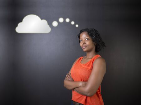 South African or African American woman teacher or student thinking with thought cloudsの写真素材