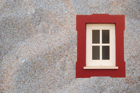 Imaginary of a window in the middle of the beach sandの写真素材