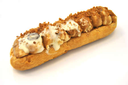 Eclaire cake filled with cream of coffee beans - appetizing sweet to eat - dessertの写真素材