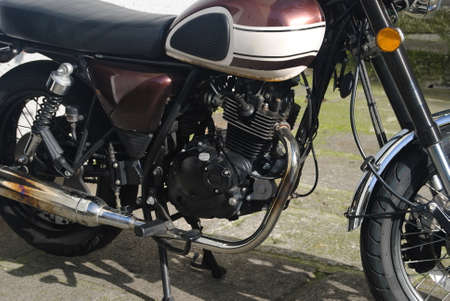 Old motorcycle of rimux and white colors