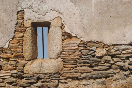 Window with nothing to back a wall in ruins
