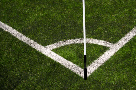 Corner line of a football field with placed flag pole - synthetic turf