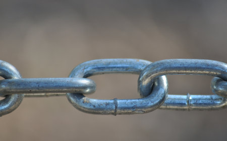 Part of a steel chain links, macro photography, strength and endurance