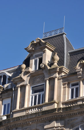 Top of old building of classic architecture with open windowの写真素材