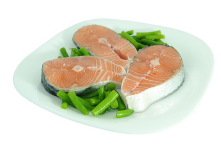 White dish with salmon and green beansの写真素材
