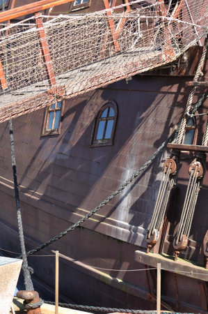 Photo of window and side rope ladder of a pirate shipの写真素材
