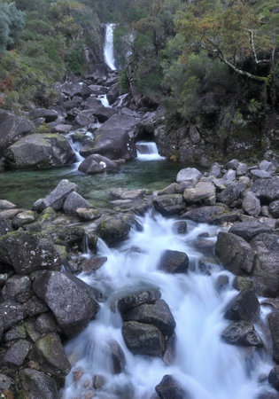 Water cascade in a mountain river, water in motion blur, rocks, Cascata da Rajada, GerÃªsの写真素材