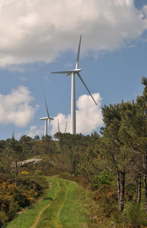 Wind turbines on a hillside in the countryside of Galicia, Spain
