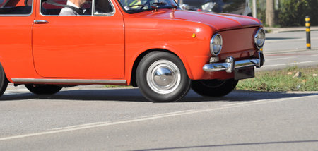 Vintage car on the road in the city. Front view.