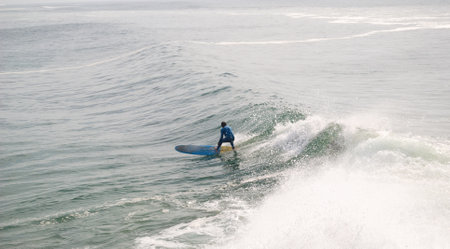Surfer on the surfboard in the ocean