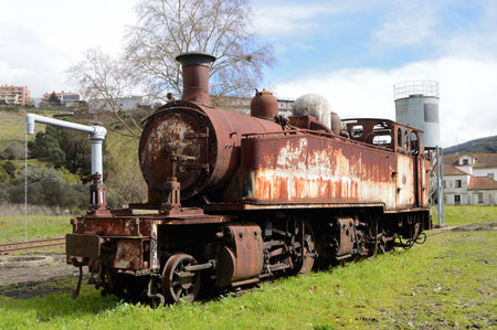 Old rusty steam locomotive in the countryside of Emilia Romagna Italyの写真素材