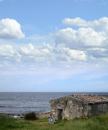 Abandoned house on the coast of the Atlantic Ocean in Portugalの写真素材