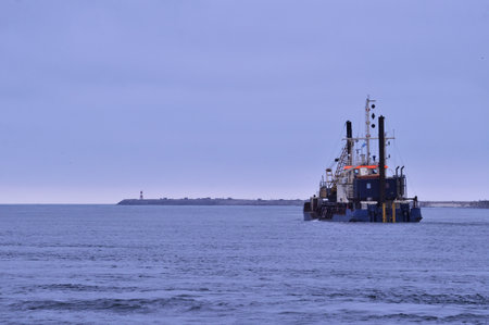 Cargo ship on the Baltic Sea in the evening. Toned.の写真素材