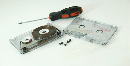 cassette tape and screwdriver isolated on the white background.