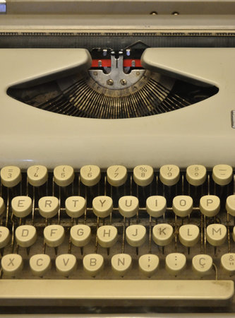Macro photography of a typewriter machine, keyboard and printing hammers