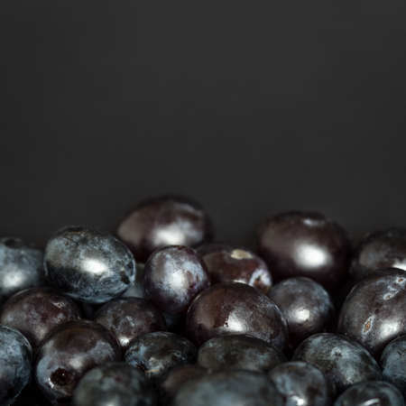Grains of red grapes arranged in a way to create copyspaceの写真素材