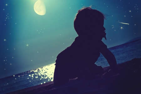 Baby fairytale. A baby under the starsの写真素材