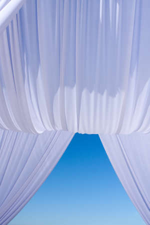Wedding canopy in white on blue skyの写真素材