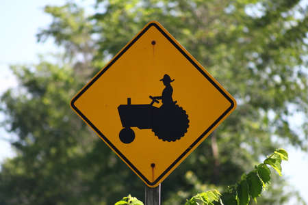 Sign warning drivers of possible tractors on the highway
