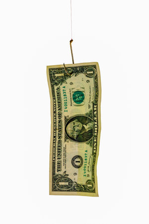 US $1 bill hanging on a fishing hook with red line, isolated on white background.の写真素材