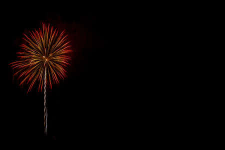 Colorful fireworks celebration in the night sky with free space for textの写真素材