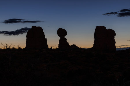 Silhouette of Balanced Rock during sunrise in Arches National Park near Moab Utahの写真素材