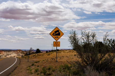 14% grade sign on scenic highway 12 in Utah near the Hogback. Selective focus, background blur and foreground blur.の写真素材