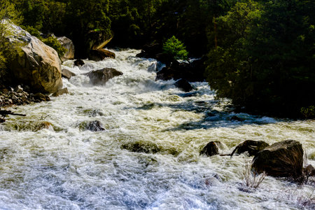 Raging Merced River from snow melt at Arch Rock Entrance in Yosemite National Park in spring of 2023