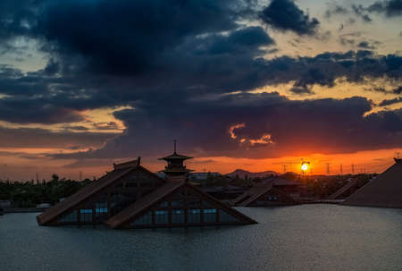 View of a building at the river during sunsetのeditorial素材