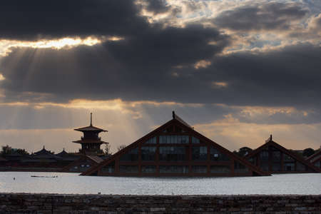 Landscape view of a building on the river during sunsetのeditorial素材