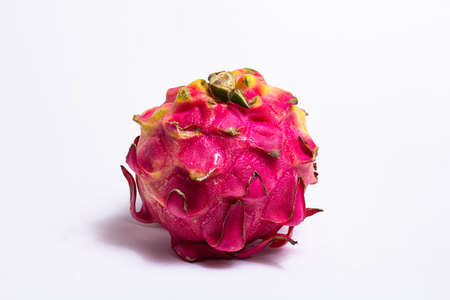 Pitahaya or dragon fruit is a cactus fruit. Red dragon fruit on a white background. Cultivated throughout the tropical and subtropical world regions. In the photo, dragon fruit from Indonesia.の写真素材
