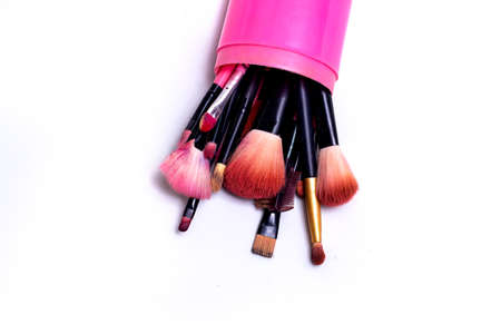 Makeup brush on a white background. Festive magic makeup concept. Templates for design.の写真素材