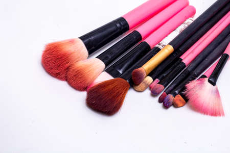 Makeup brush on a white background. Festive magic makeup concept. Templates for design.の写真素材