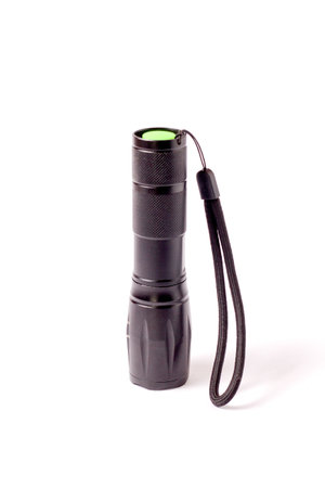 LED flashlight with spotlight for hiking at night. battery powered flashlight on white background....