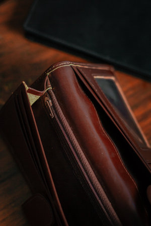 Wallet, cards, credit. Stylish leather wallet in box on wooden background. Leather wallet on wood...