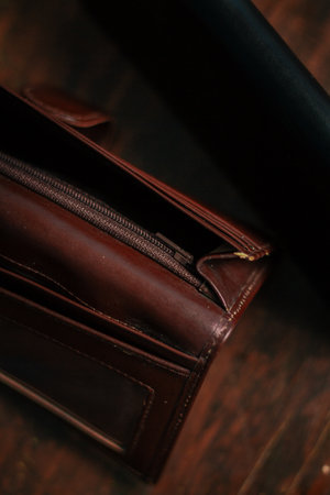 Wallet, cards, credit. Stylish leather wallet in box on wooden background. Leather wallet on wood texture. Leather craftsman. Leather Craft.の写真素材