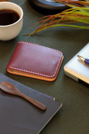 Products made from leather. Bag or sling bag made of brown leather with a minimalist style or retro colors that are minimalist and luxurious. Leather wallet.の写真素材
