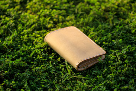 Products made from leather. Bag or sling bag made of brown leather with a minimalist style or retro...