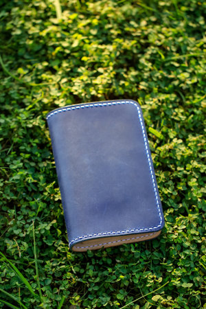Products made from leather. Bag or sling bag made of brown leather with a minimalist style or retro...