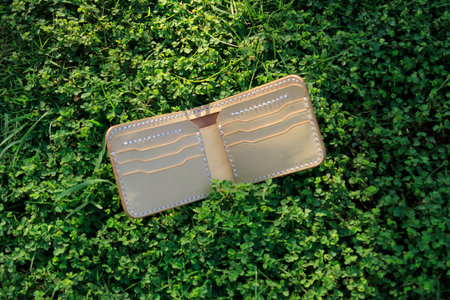 Products made from leather. Bag or sling bag made of brown leather with a minimalist style or retro...