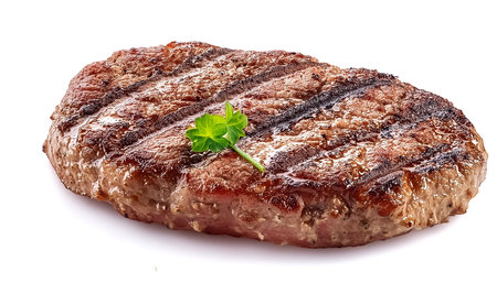 freshly grilled burger meat isolated on white background, top view.の写真素材