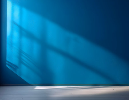 Blue blank wall interior background, with shadow from window. Background concept studio and backdrops show products.の写真素材