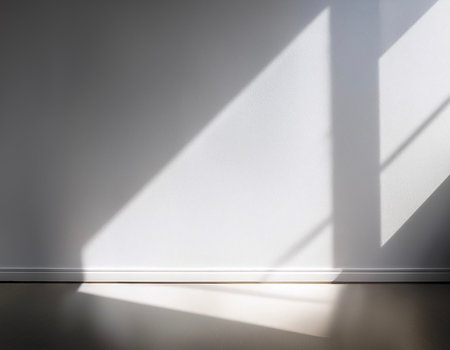 White blank wall interior background, with shadow from window. Background concept studio and backdrops show products.の写真素材