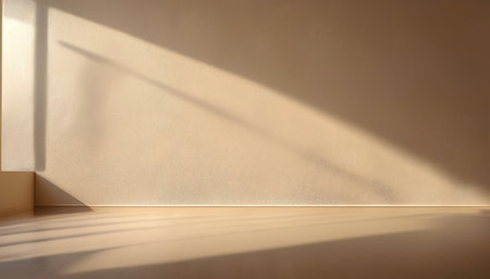 Beige blank wall interior background, with shadow from window. Background concept studio and backdrops show products.の写真素材